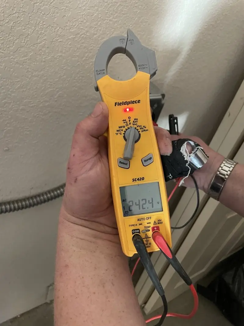 Voltage testing with clamp meter during Generator Installation in Campbell